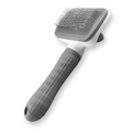 CleanPin self-cleaning slicker brush with gray comfort grip, on a white background